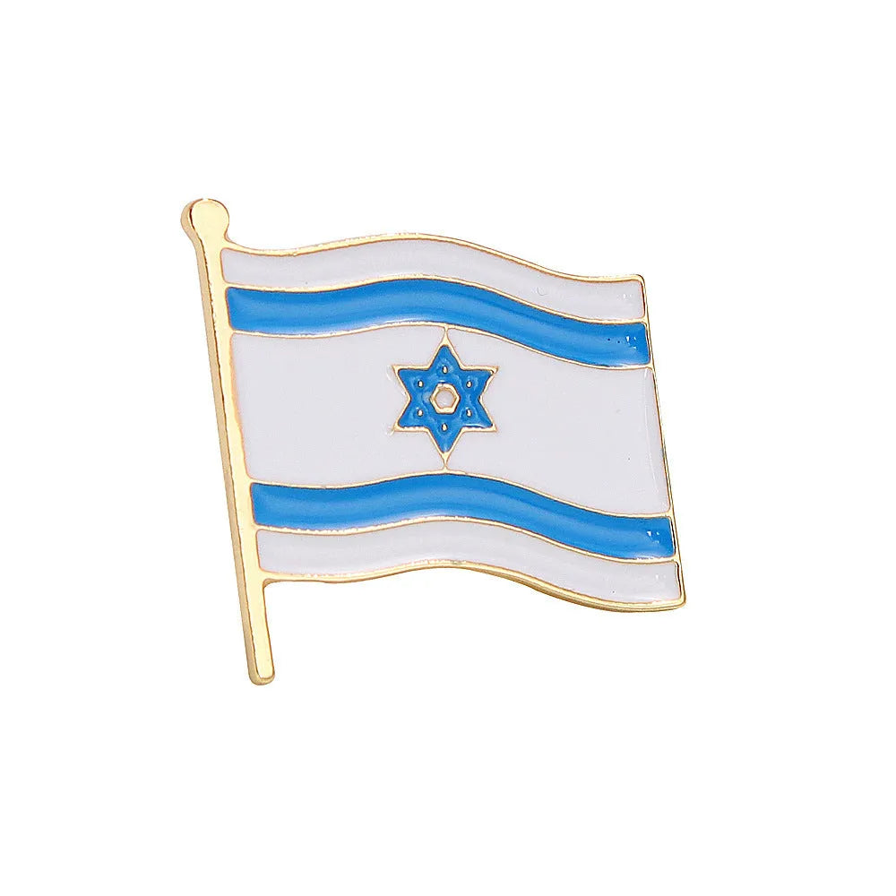 Square corrugated alloy brooch with Palestinian flag design on a neutral background