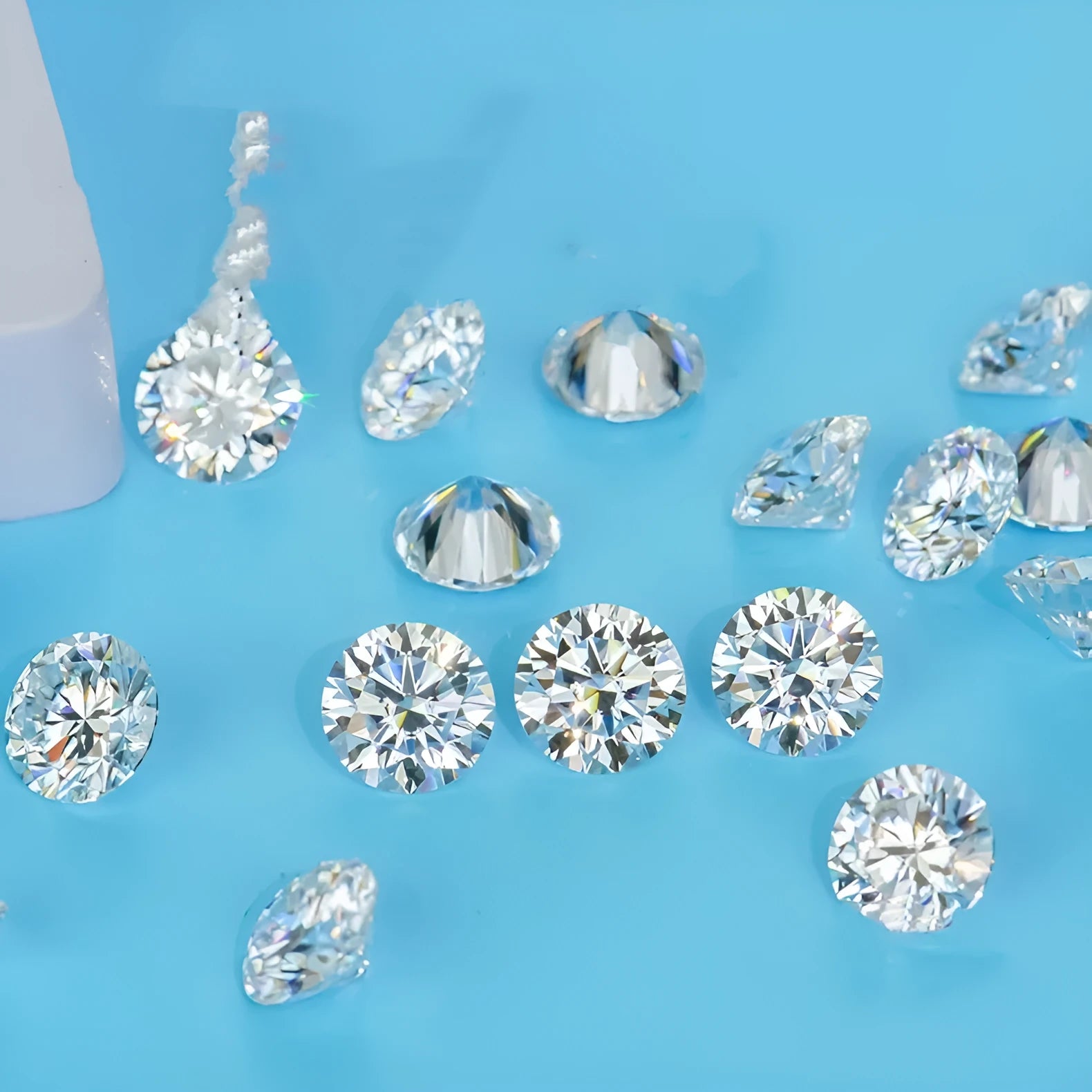 Round moissanite gemstone showing the eight hearts and eight arrows faceting pattern.