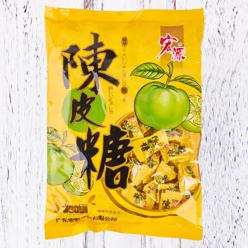 Three separate bags of hard candy: guava flavour, plum sugar flavour, and tangerine peel flavour.