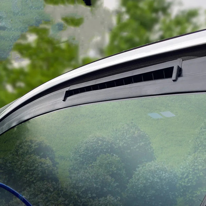 Black and white car ventilation fan with USB cable for reducing exhaust odours