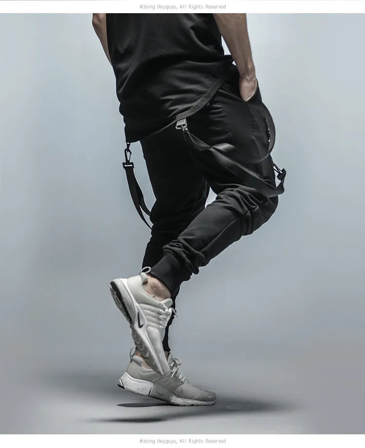Men's black cotton blend pencil sweatpants with belt, flat lay showing tapered leg and waist elastic
