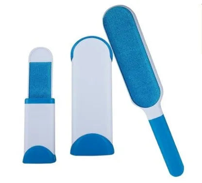Blue reusable pet hair removal comb with double-sided brush head next to its self-cleaning base.