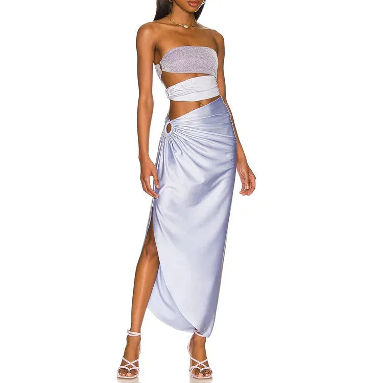 Purple women's one-piece swimsuit with hollow design and matching wrap skirt.