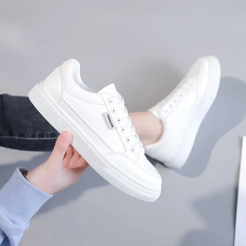Women's white and brown Korean-style low-top sneakers with artificial PU upper and plastic sole.