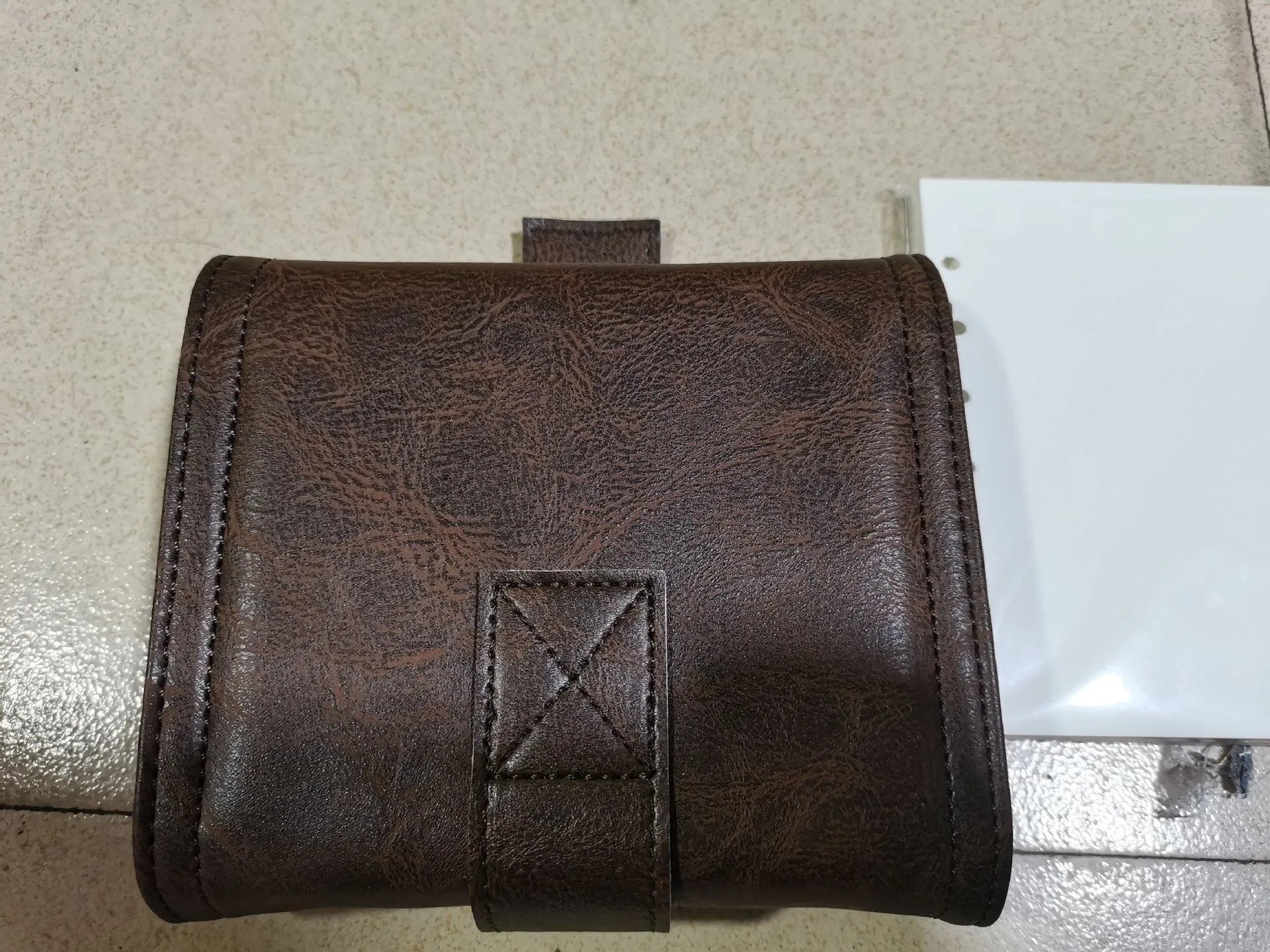 Brown retro leather buckle notebook with loose-leaf binder binding and A7 size format