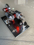 2019 Red upgrade miniature Stirling engine toy on a desk, 155x80x85mm, showing flywheel and cylinder