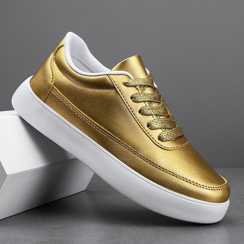 Women's white leather flat casual shoes with lace-up front on a plain background.