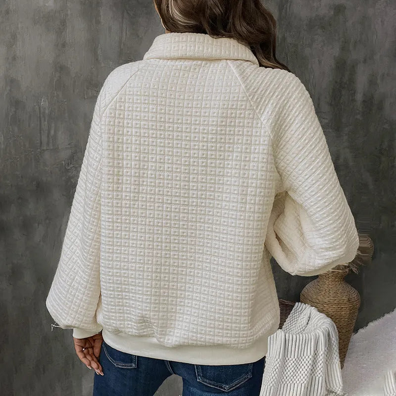 Women's beige texture polo collar solid colour pullover sweater on a hanger.