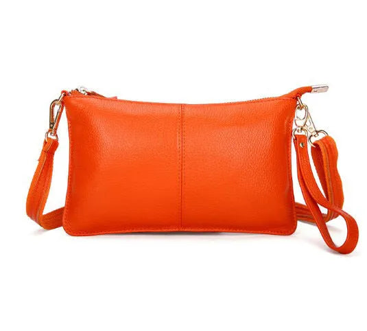 Structured cowhide leather lady slant bag showing front zipper compartment and dual strap options