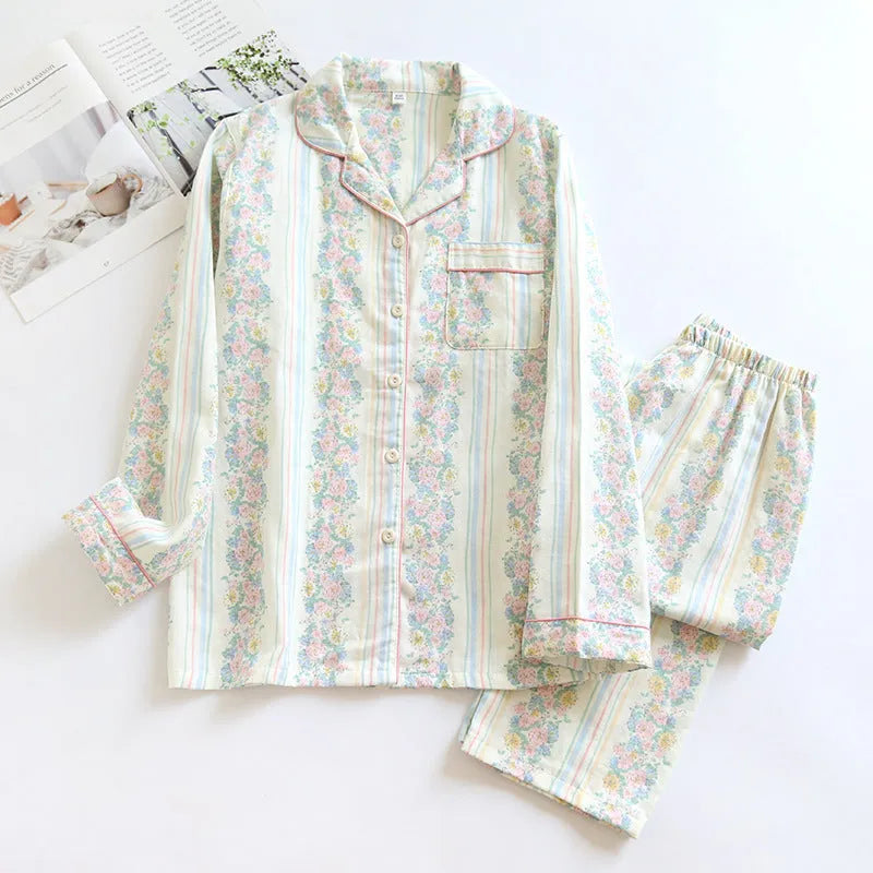 Ladies' red and white striped cotton gauze long-sleeved top and trousers loungewear set laid flat.