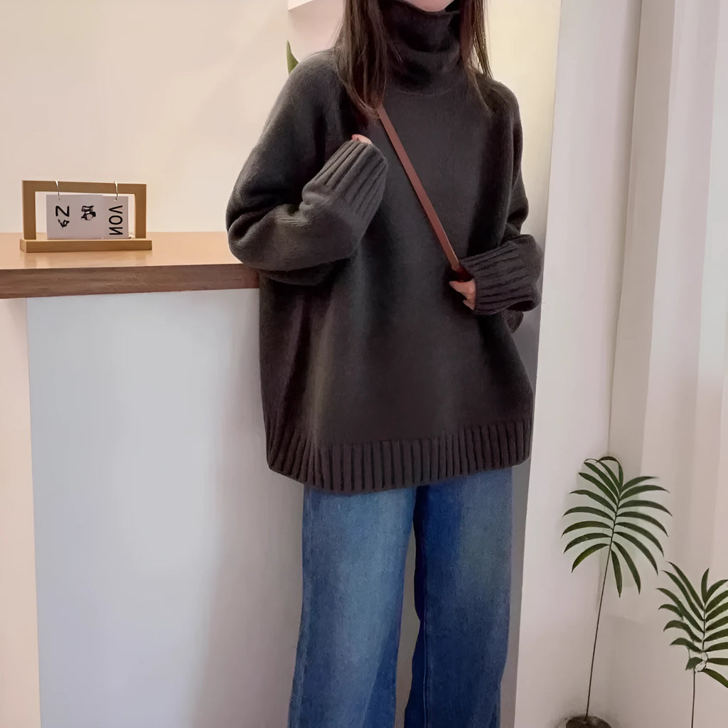 Women's loose red turtleneck sweater with thick curling pile collar, casual style.