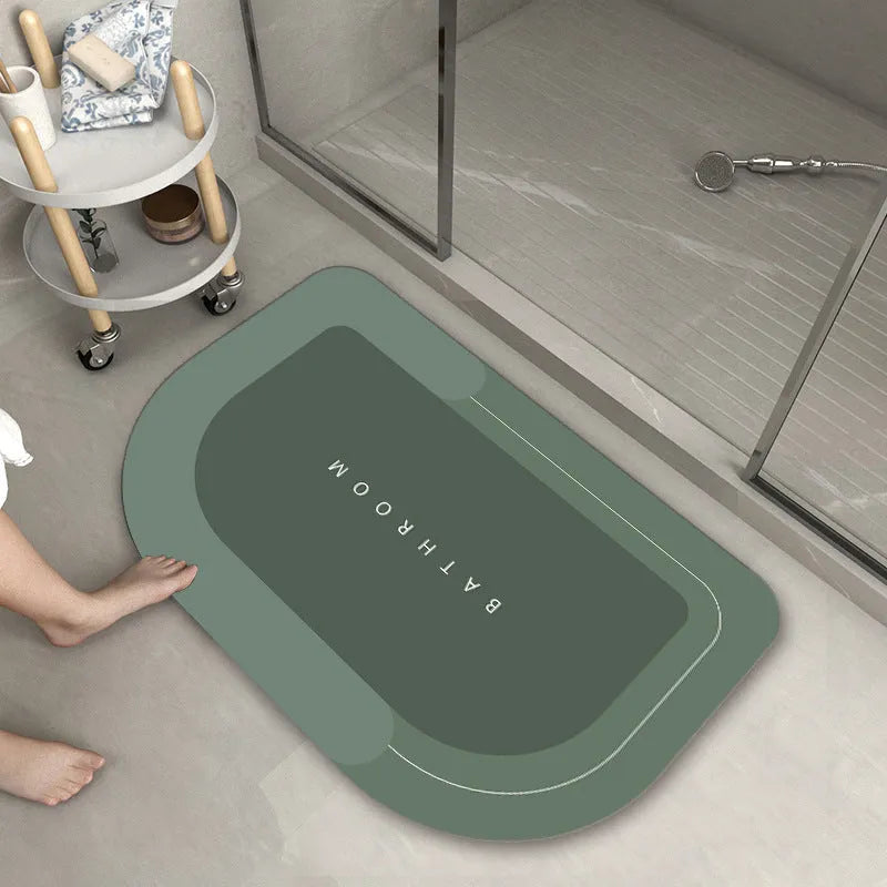 Blended fabric bathroom floor mat in oval and rectangular shapes on a tiled floor.
