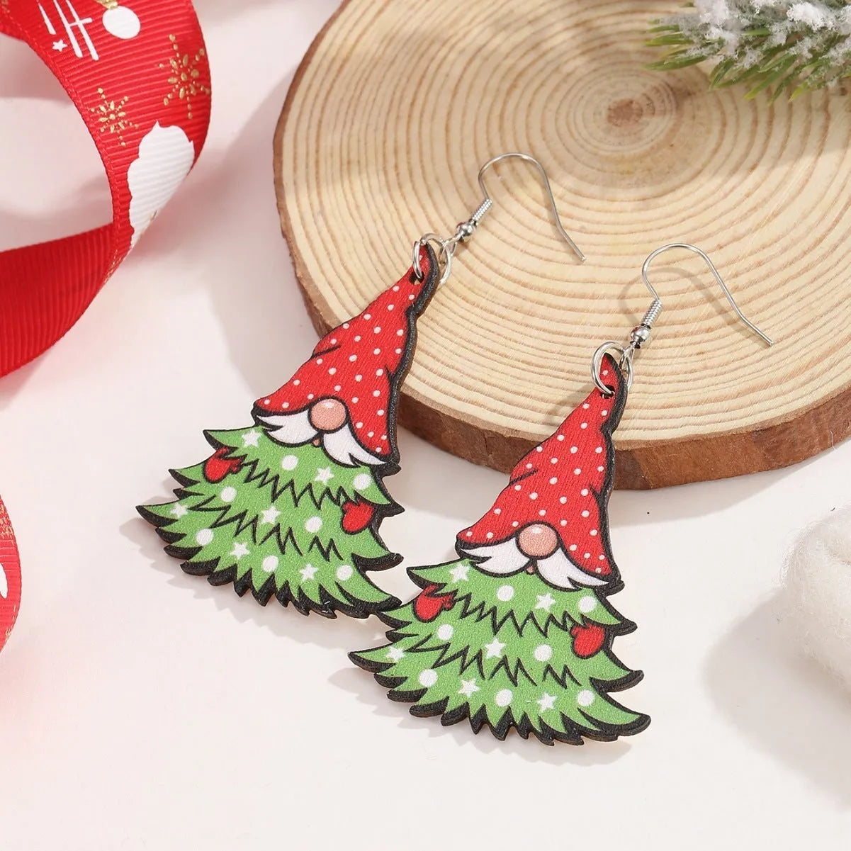 Wooden Christmas earrings with geometric Christmas tree and water drop snowman designs featuring Santa Claus motifs