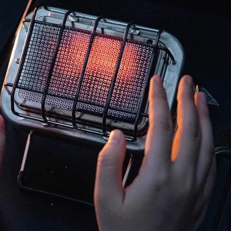 Compact metal outdoor electric heating stove with voltage regulator, shown in a silver finish.