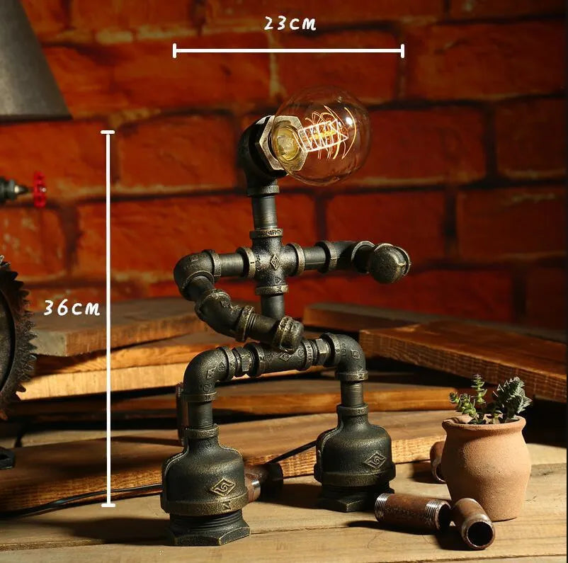 Robot vintage industrial table lamp with iron pipe construction in green bronze finish
