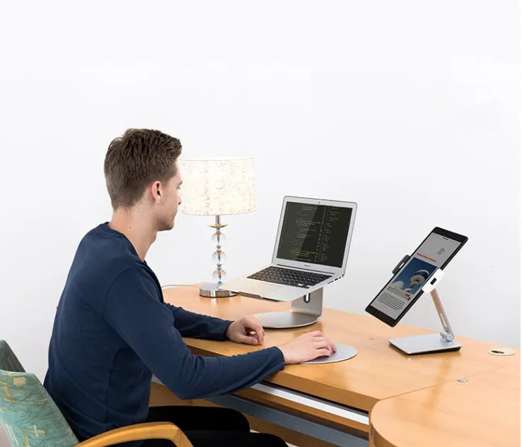 Foldable aluminium and ABS desktop stand holding a tablet at an angle.