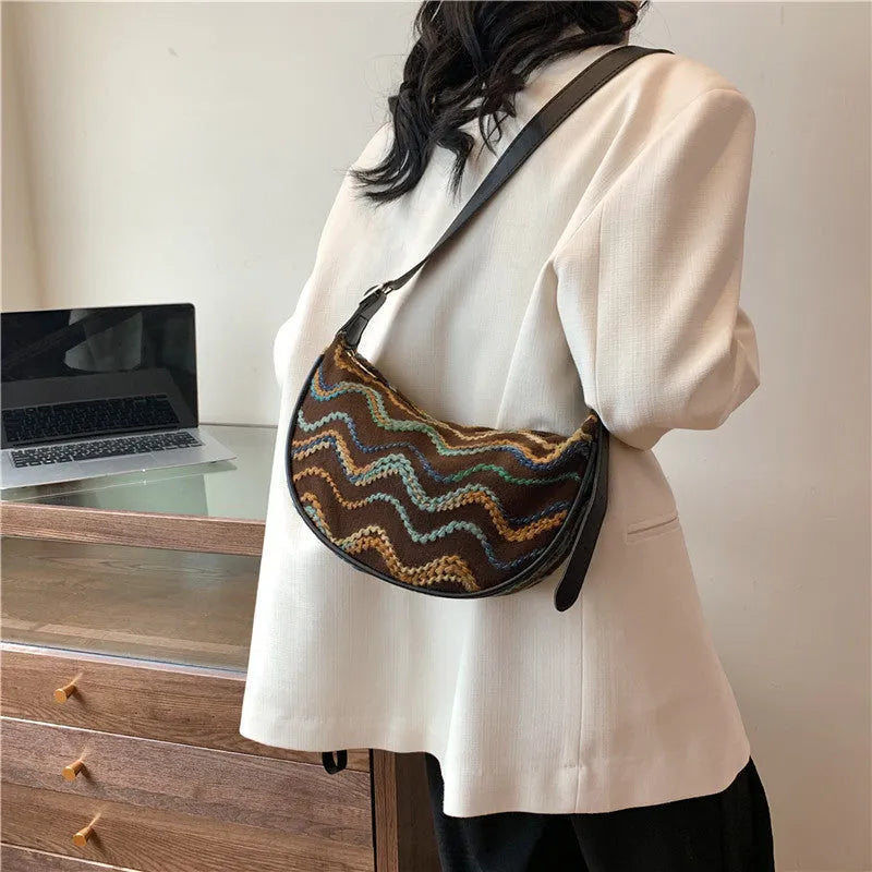 Women's straw woven crossbody bag with internal phone and file organisers in corrugated brown