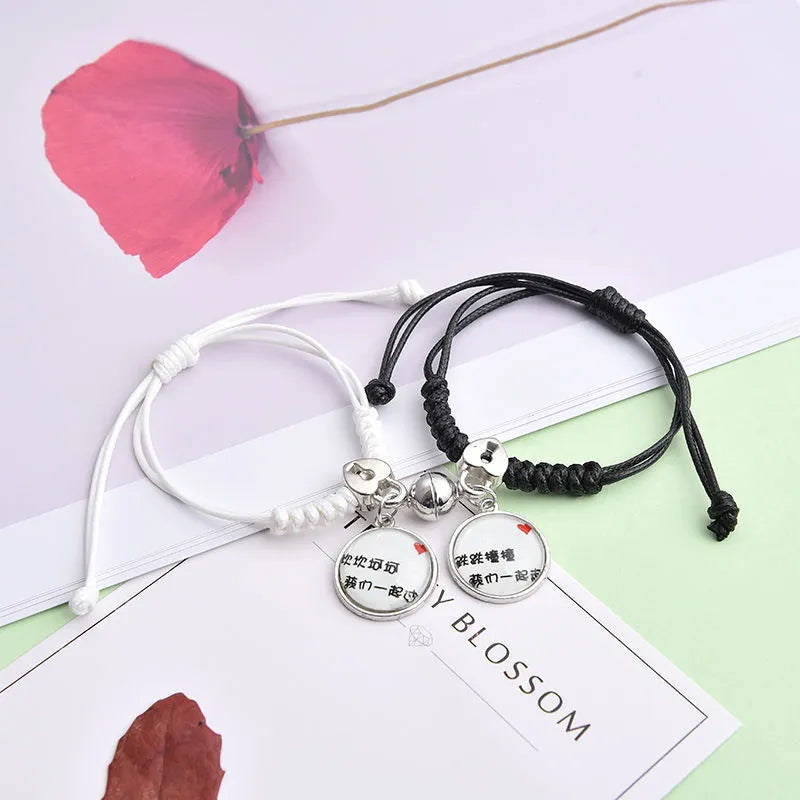 Magnetic couple bracelet pair with alloy electroplating in various designs including clover and crown patterns