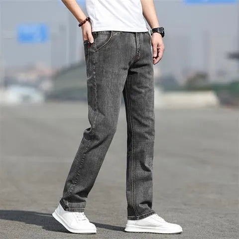 Men's smoky grey autumn jeans with straight tube fit and low waist design on hanger