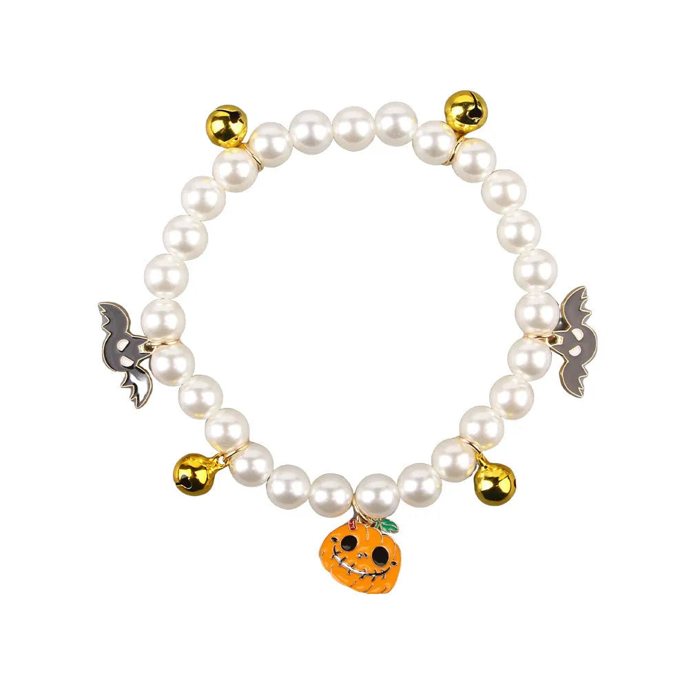 Halloween cat collar with simulated pearl necklace decoration showing pumpkin print patterns