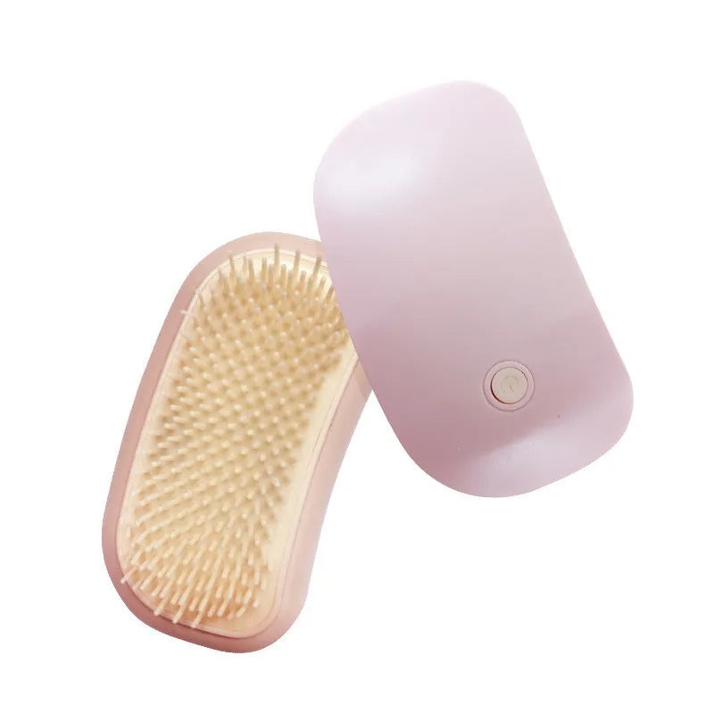 Pink electric pet massage brush with TPE comb teeth for grooming cats and dogs