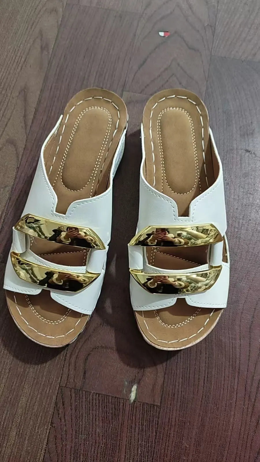 Roman style platform sandals in black, white, khaki, and sea blue colours on a rubber sole.
