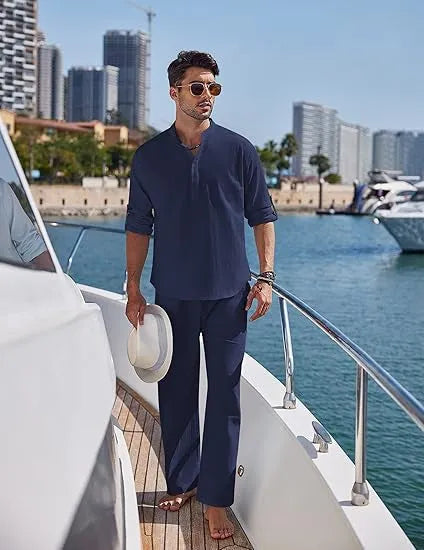 Men's solid colour cotton suit with long sleeve top and trousers in beige, shown laid flat