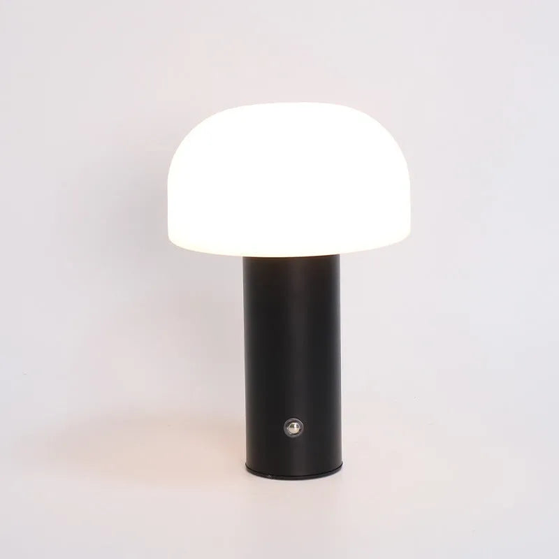 USB dual-purpose table lamp in black, green, orange or white with plug-in and charging functionality