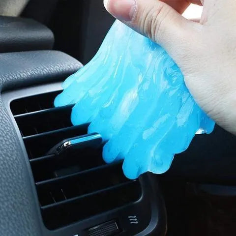 160g boxed blue magic cleaning gel universal cleaning mud on a wooden surface with dust specks