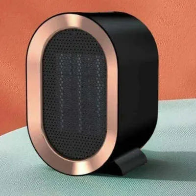 Compact black desktop electric fan heater with mechanical control dials and a safety grille.