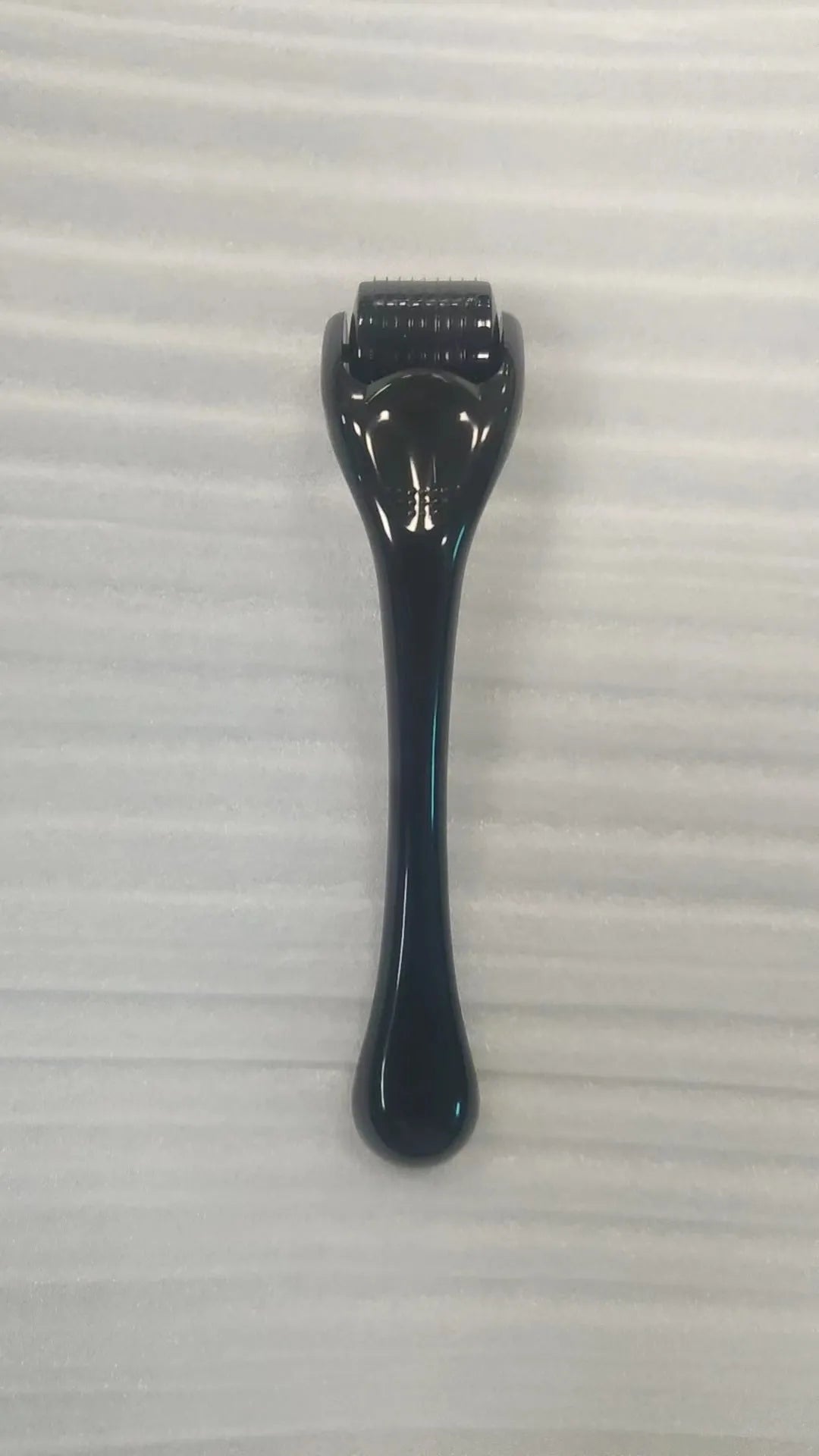 Sterile micro needle derma roller with PC handle in selected colour and 0.2mm, 0.25mm, or 0.3mm needle wheel.
