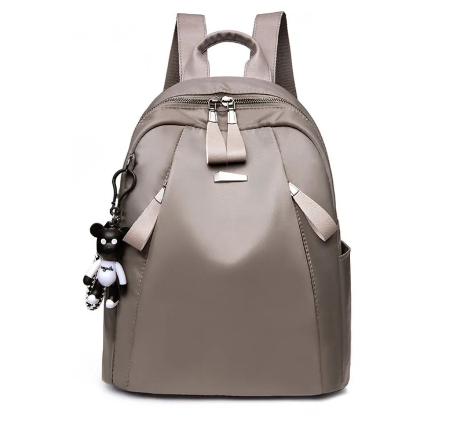 Medium square Oxford cloth rucksack in black with double straps and a front digging bag.