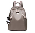 Medium square Oxford cloth rucksack in black with double straps and a front digging bag.