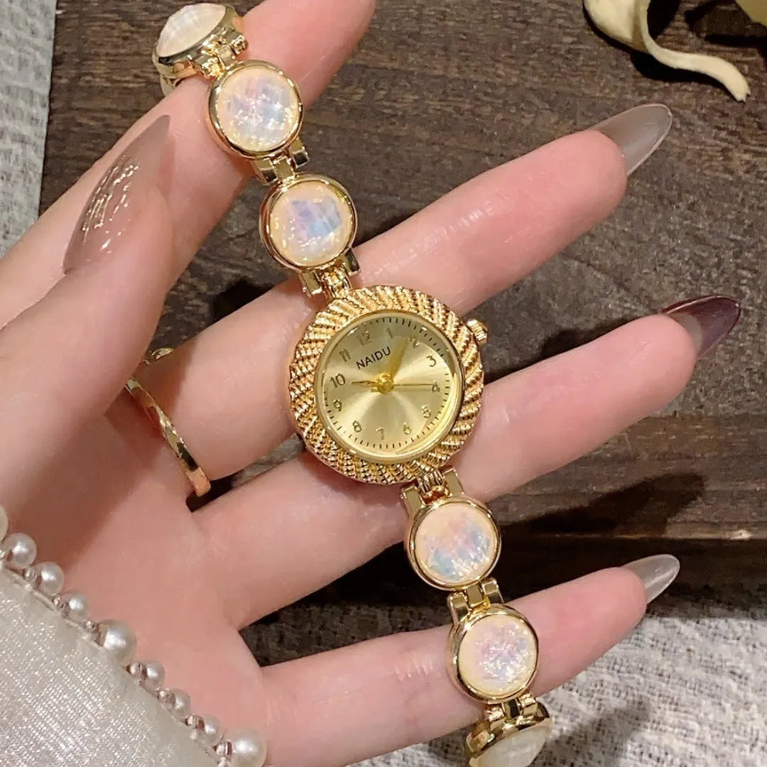Women's quartz watch with 25mm round dial and zinc alloy case in milky white colour.