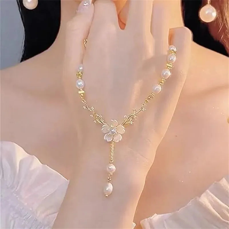 Alloy necklace with pearl flower pendant and floral design on pearl chain