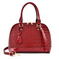 Shiny black PU leather crossbody shoulder bag with a structured shell shape.