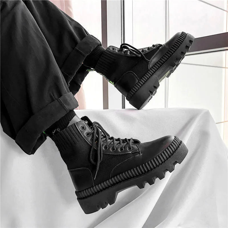 Men's black platform ankle boots with 8-eye lacing and a side zipper on a rubber sole.