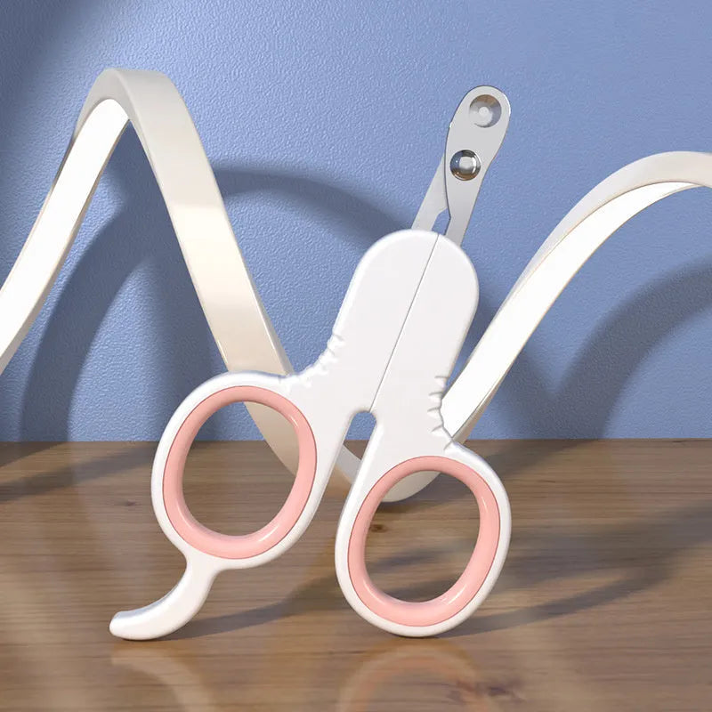 Professional pet nail clippers with curved safety tips and a grey non-slip rubber handle.