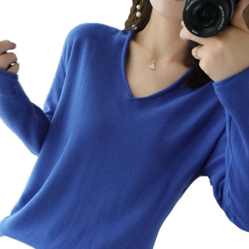Women's V-neck long sleeve knitwear pullover top in a macaron colour on a hanger.
