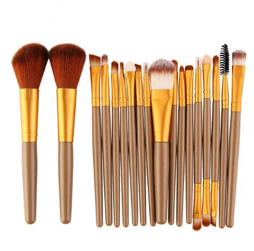 MAANGE 18-piece makeup brush set with fan-shaped cosmetic tools laid out on a table.
