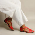 Red women's plus size sandals with square buckle and herringbone toe holder on white background