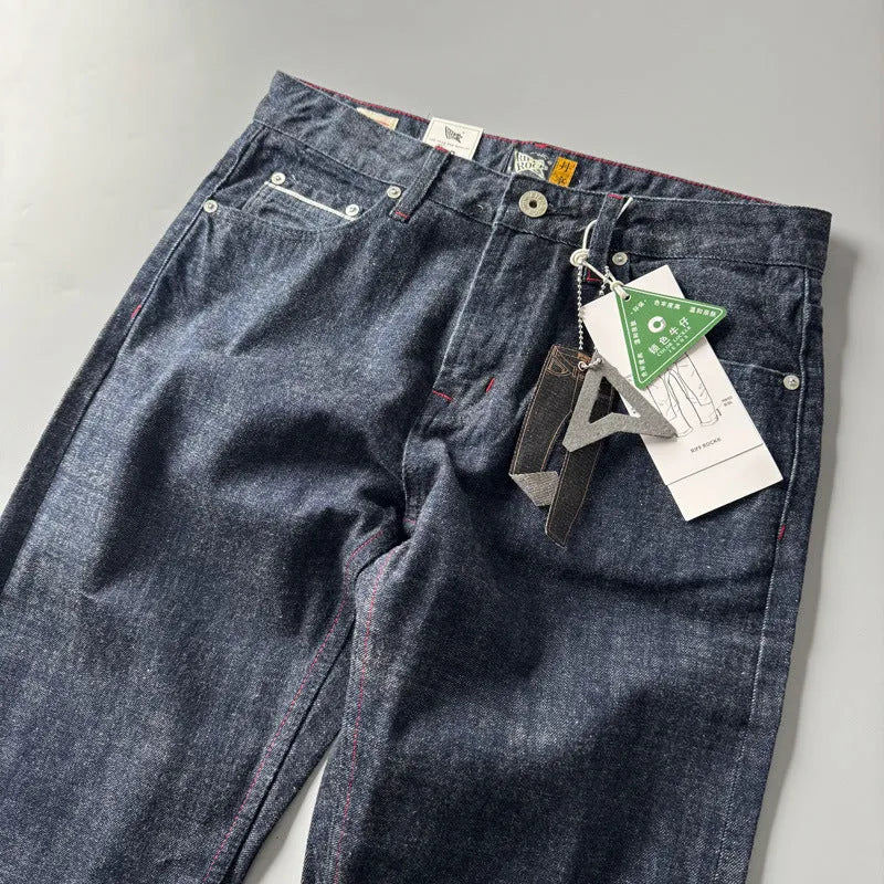 Men's primary colour straight-leg denim jeans with a mid-waist, shown on a size chart.