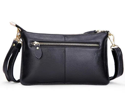 Structured cowhide leather lady slant bag showing front zipper compartment and dual strap options