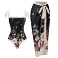 Women's yellow one-piece swimsuit with floral pattern and matching white chiffon skirt.
