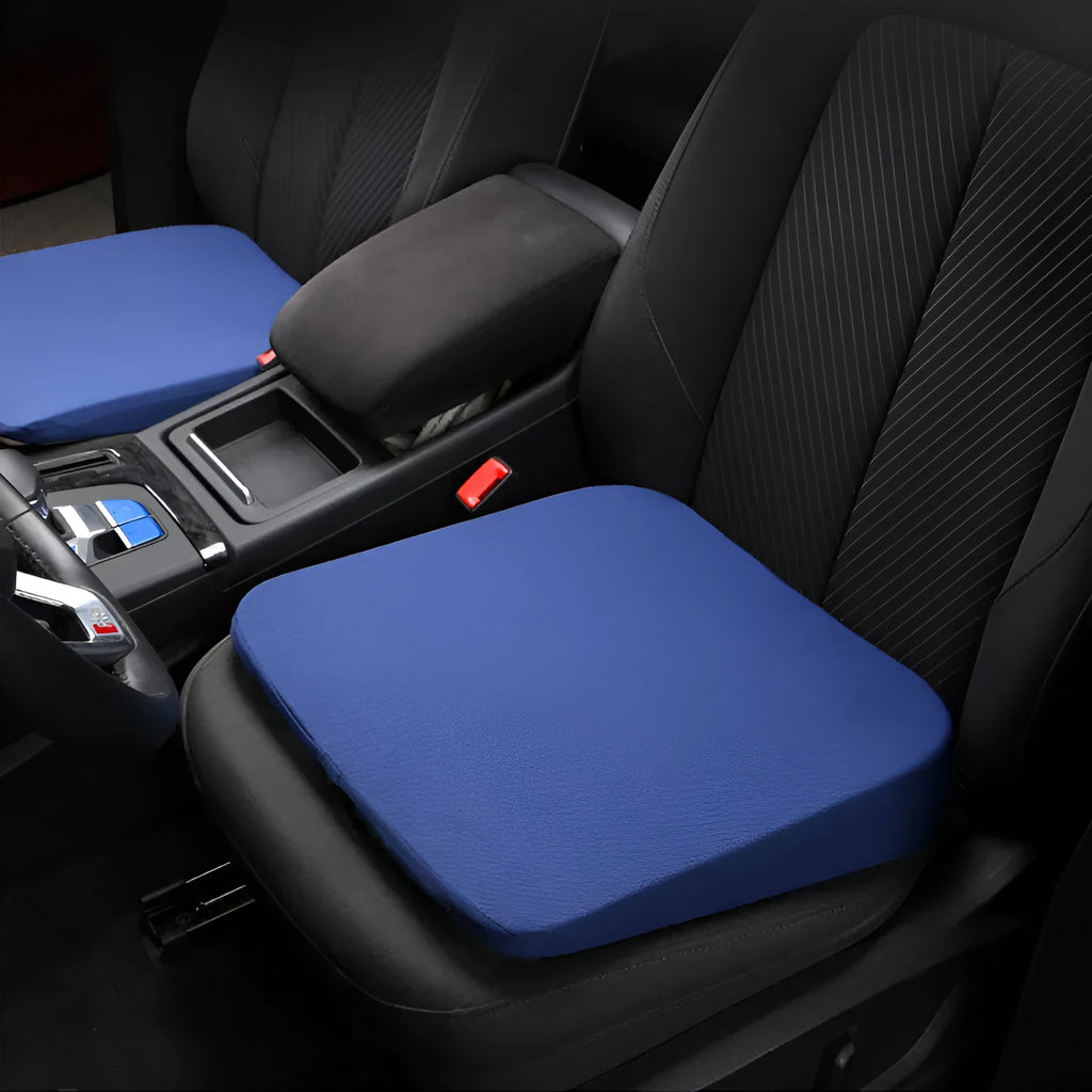 Black rectangular car seat cushion with 6cm thickness on a car seat.