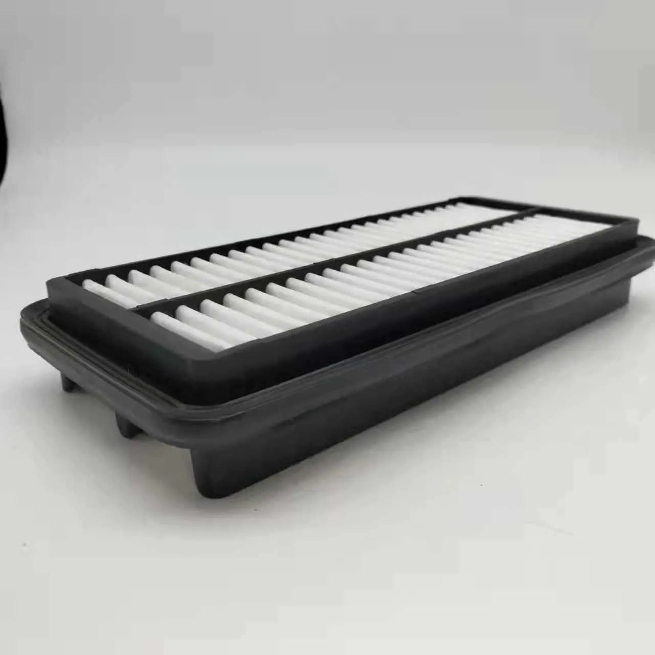 Black rectangular car air filter measuring 256mm by 113mm by 40mm