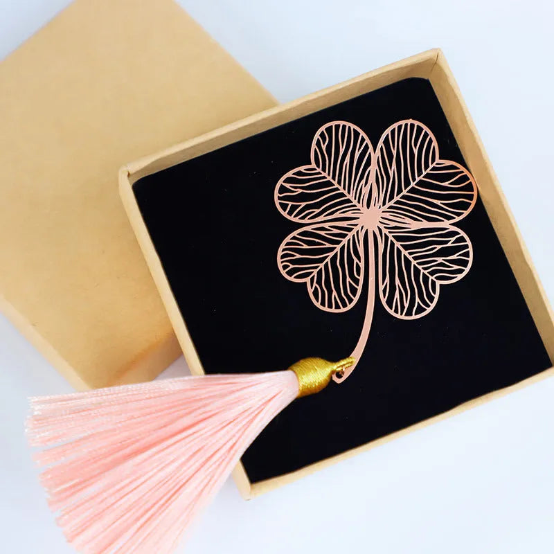 Brass metal bookmark with hollow leaf pattern design and rose gold tassel
