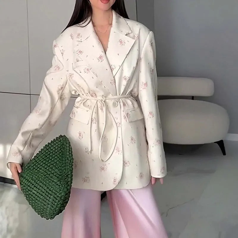 Women's suit jacket with lace-up waist detail in polyester fabric, shown in apricot colour