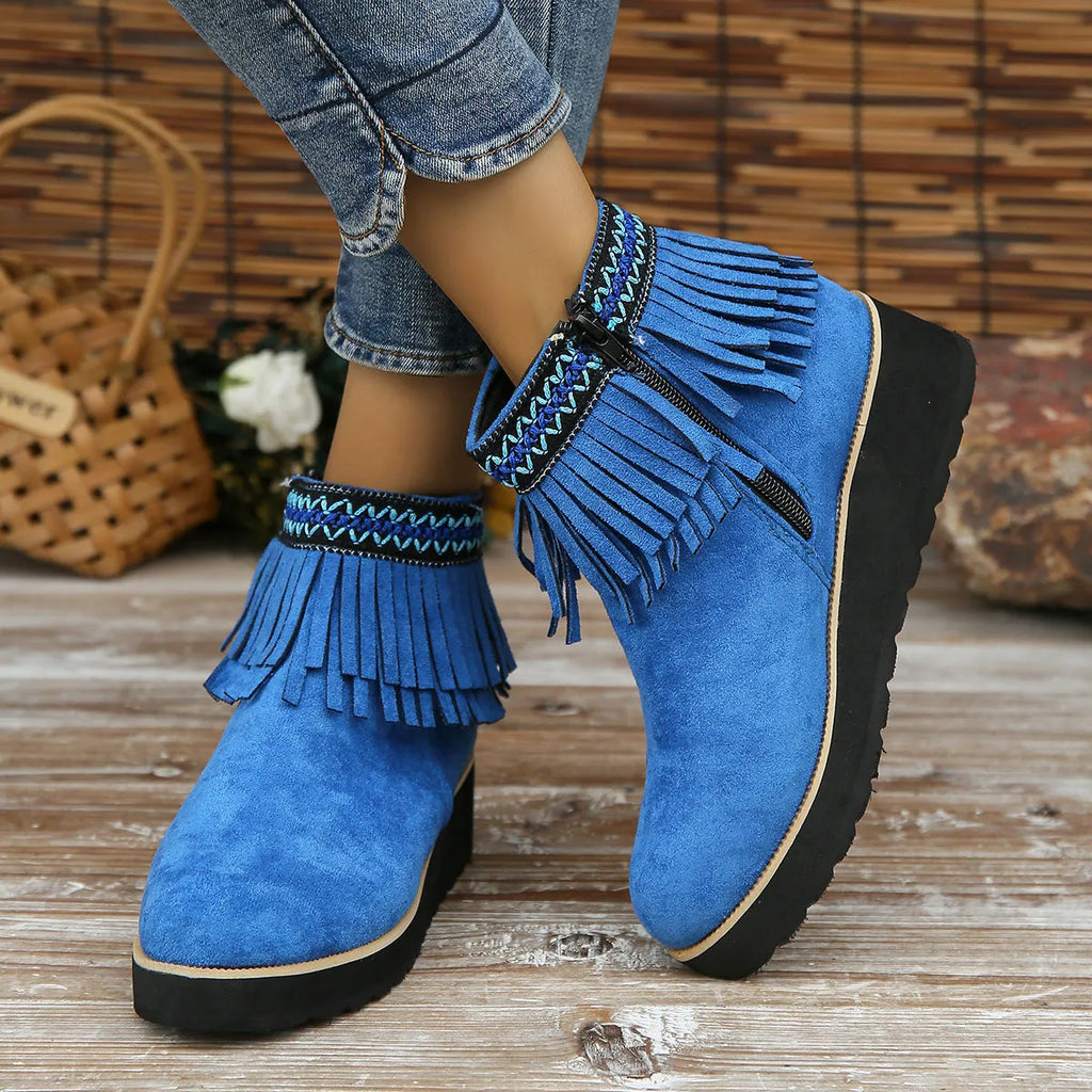 Women's dark brown suede wedge ankle boots with a side zipper and decorative tassel.