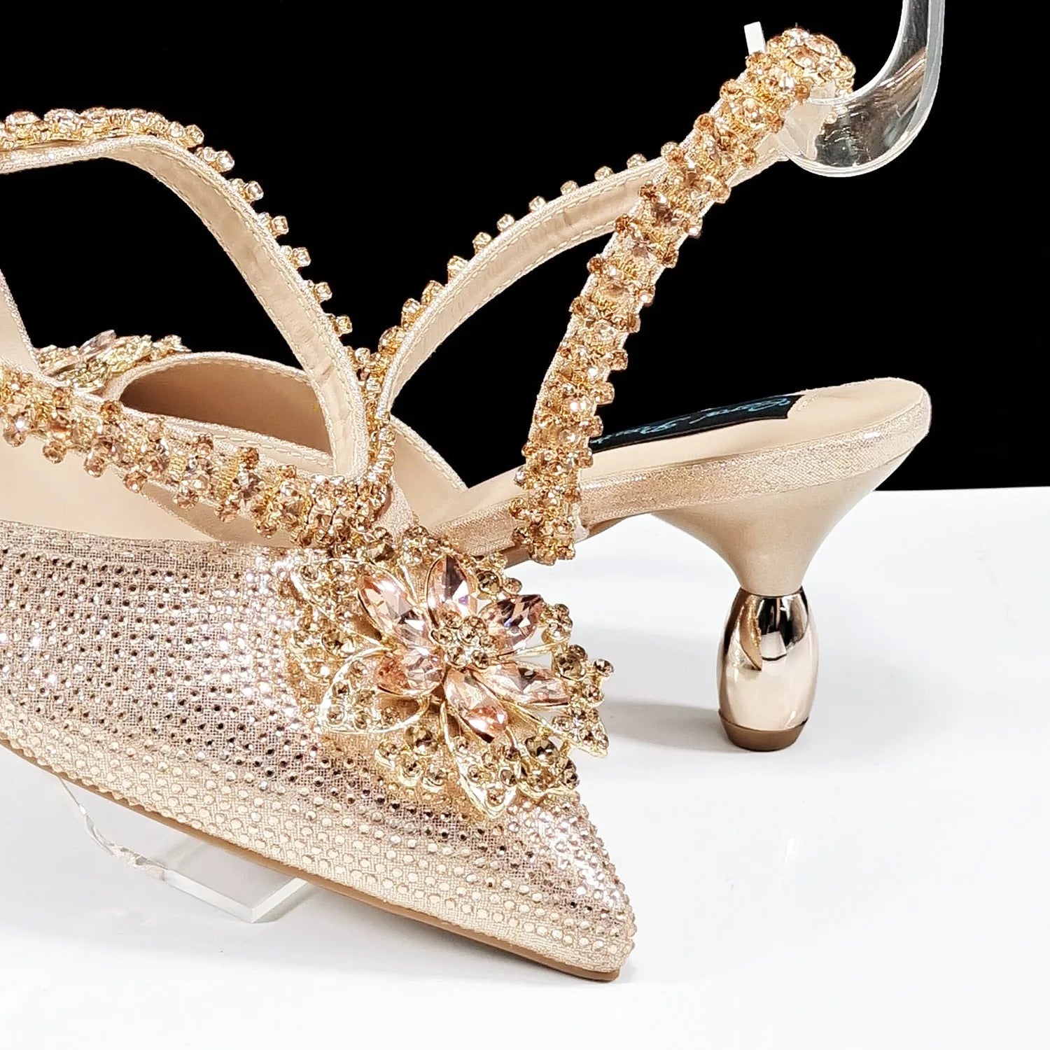 Women's black high heel shoes with matching clutch bag, decorative drill buckle flower ankle chain, and rhinestone details.